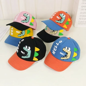 Close-up of adorable dinosaur embroidery on colorful cotton baseball caps for kids