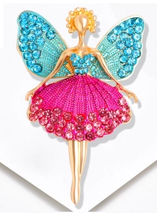 Macro shot of elegant ballet dancer brooch with blue wings and rose red rhinestone skirt