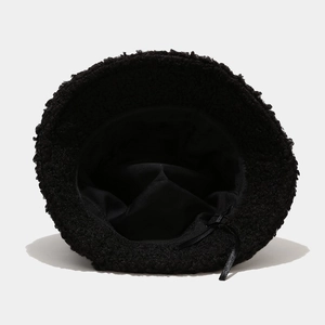 Unisex black teddy fleece bucket hat with warm faux fur texture and adjustable drawstring