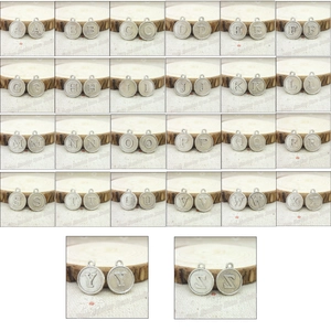 Macro display of 26 alphabet charms in vintage silver finish for DIY jewelry