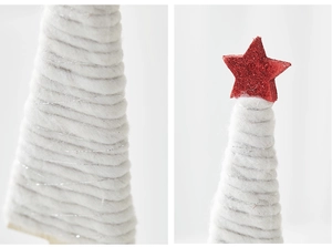 Macro detail of white wool Christmas tree with red glitter star and silver thread accents