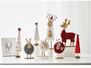 Detailed view of Nordic wool felt Christmas figurines including reindeer and trees