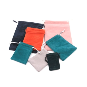 Various sizes and colors of velvet drawstring bags for jewelry packaging and gift storage