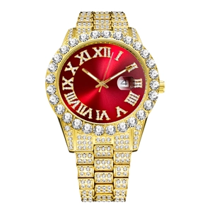 Macro shot of luxury gold watch featuring red sunburst dial and iced-out stone bezel