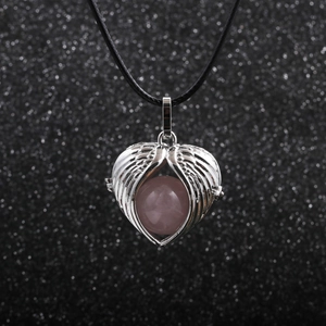 Pink gemstone angel wings heart pendant on a black cord necklace for women