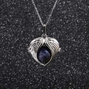 Stainless steel necklace featuring silver angel wing heart pendant with blue gemstone