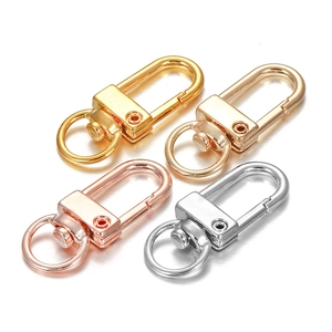 Set of four alloy lobster swivel clasps in gold, rose gold and silver finishes