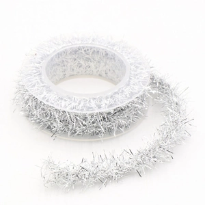 Silver metallic Christmas tinsel ribbon roll for holiday gift wrapping and DIY decoration