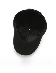 Close-up of the thick warm fleece lining and foldable ear flaps inside the wool winter cap
