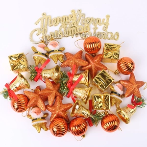 Assorted gold and orange Christmas tree ornaments including Santa, bells and stars