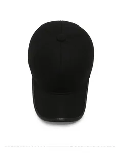 Detailed top view of black winter baseball cap with reinforced leather brim and logo patch