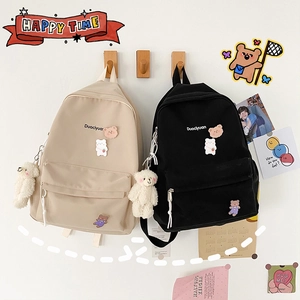 Cute Korean style canvas backpack for students in black and white with bear charm and patch