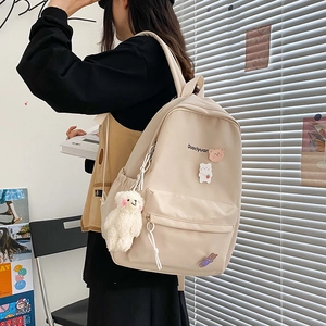 Minimalist beige canvas backpack with cute bear pendant and pins for students