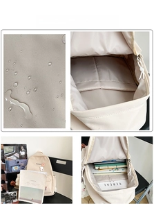 Detail view of water-resistant beige backpack with multiple A4 size storage compartments