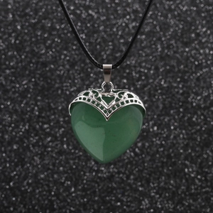 Green heart pendant necklace with silver hollow wrap on a black cord