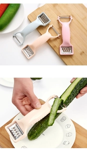 Dual-head kitchen peeler and julienne grater tool shown in multiple colors on a board