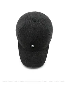 Detail of wool texture and outdoor sports patch on a dark grey adjustable baseball cap