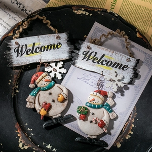 Christmas snowman welcome sign door hanging with rustic rattan ring and holiday decor