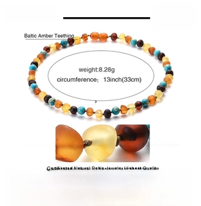 Macro detail of 33cm natural amber and turquoise baby necklace with 8.28g weight
