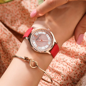 Starry sky women's quartz watch with diamond-set dial and red leather strap on wrist