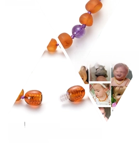 Detail of Baltic amber baby bracelet with amethyst beads and secure safety screw clasp