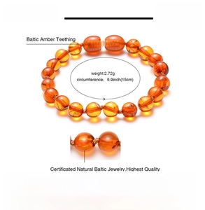 Macro detail of natural Baltic amber beads bracelet with secure twist clasp design