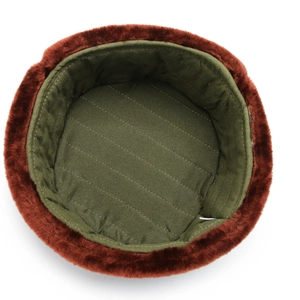 Winter thermal trapper hat with green quilted lining and brown faux fur ear flaps