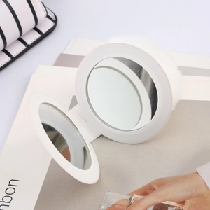 Portable white faux fur folding makeup mirror for handbag charm and touch-ups