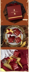 Detail of wine red and gold wedding candy boxes with ribbons and festive gold patterns