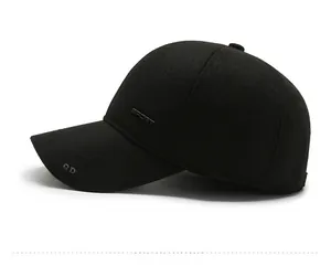 Side view of men's winter baseball cap in black wool with plush lining and sport logo