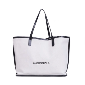 Minimalist beige canvas tote bag with black handles and large JINGPINPIJU text