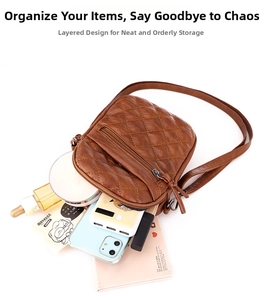 Detail view of brown quilted crossbody bag showing dual zipper compartments and interior capacity