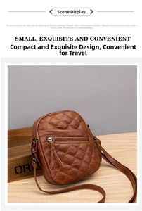 Detail of brown quilted faux leather crossbody bag with dual zipper compartments