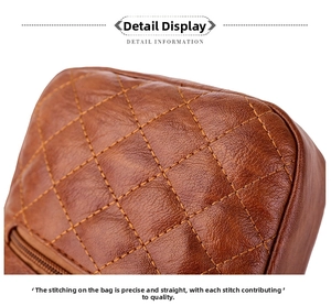 Close-up of brown quilted leather texture with diamond stitching and metal zipper detail
