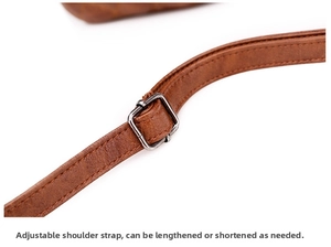 Detail of brown quilted leather strap with adjustable silver metal buckle on a shoulder bag
