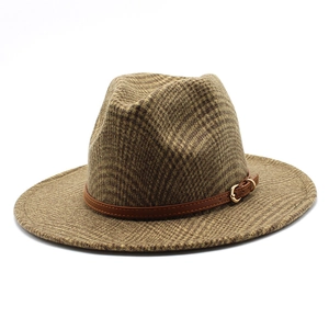 Detail of vintage brown plaid wool fedora hat featuring leather band and gold metal buckle