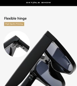 Close-up of flexible hinge design and glossy black finish on large frame sunglasses