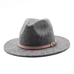 Detailed texture of gray felt fedora hat featuring a pink leather buckle band decoration