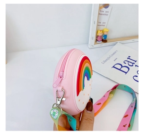 Detail view of pink silicone mini bag with 3D rainbow and colorful strap for girls