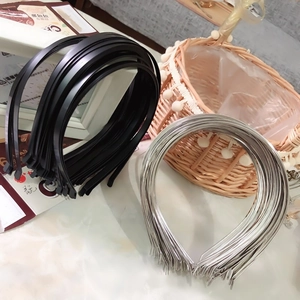 Detail view of stacked black and silver metal headbands for DIY handmade crafts