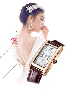 Detail of a square rose gold watch with brown leather strap and Roman numeral dial