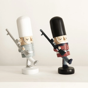 Pair of British style nutcracker soldier figurines for creative home decor on light background