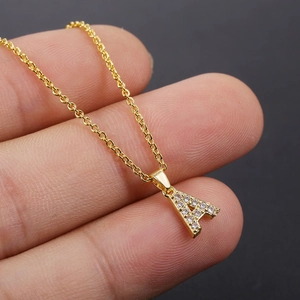 Chic gold A-letter pendant necklace with sparkling cubic zirconia on a dainty chain