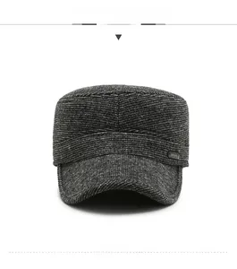 Detail of dark grey winter military flat cap with knit texture and Sport emblem