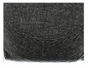 Close-up of the meticulous cap suture technique and grey tweed texture on the winter hat