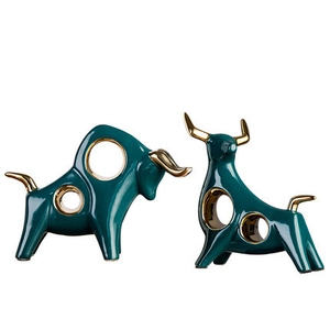 Modern abstract emerald green ceramic bull statues with golden horns and minimalist design