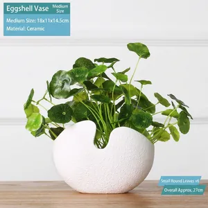 Modern white ceramic egg-shaped vase with matte finish and artificial greenery, 27cm high