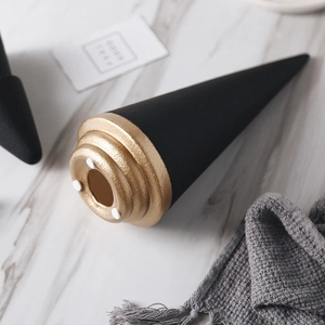 Nordic ceramic Christmas tree figurine with black matte finish and golden metallic base
