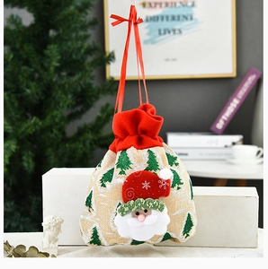 Detailed view of burlap Christmas drawstring gift bag with 3D Santa Claus applique