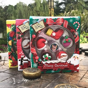 Close-up of Christmas eraser gift set featuring Santa, reindeer, and festive icons